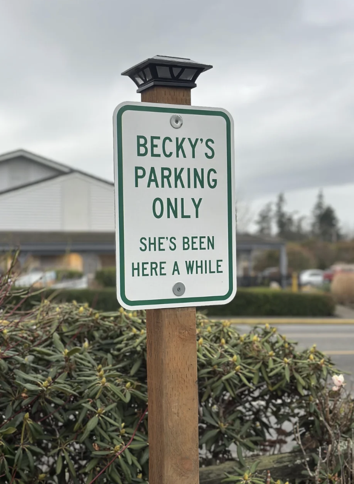 A motion   reads, "Becky's Parking Only. She's Been Here a While," humorously reserving a parking space
