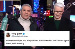 Two men stand together on a TV set. One holds a bottle. A tweet overlay reads: "anderson cooper and andy cohen are allowed to drink on tv again the world is healing."