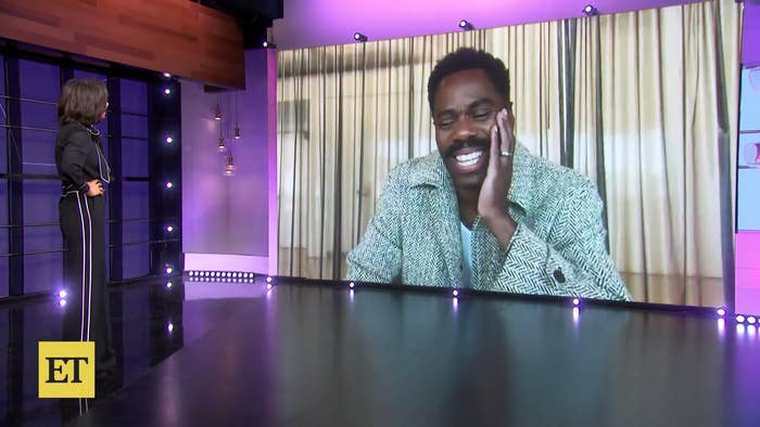 Nischelle Turner interviews Colman Domingo via a large screen. Colman is grinning