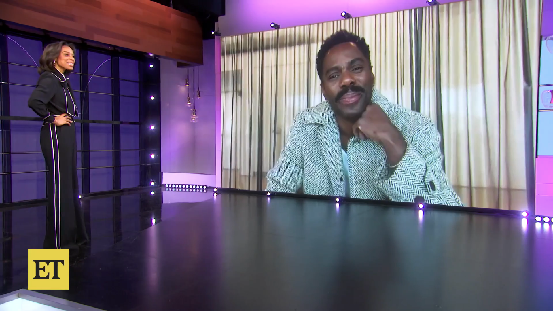 Nischelle Turner interviews Colman Domingo via a large screen