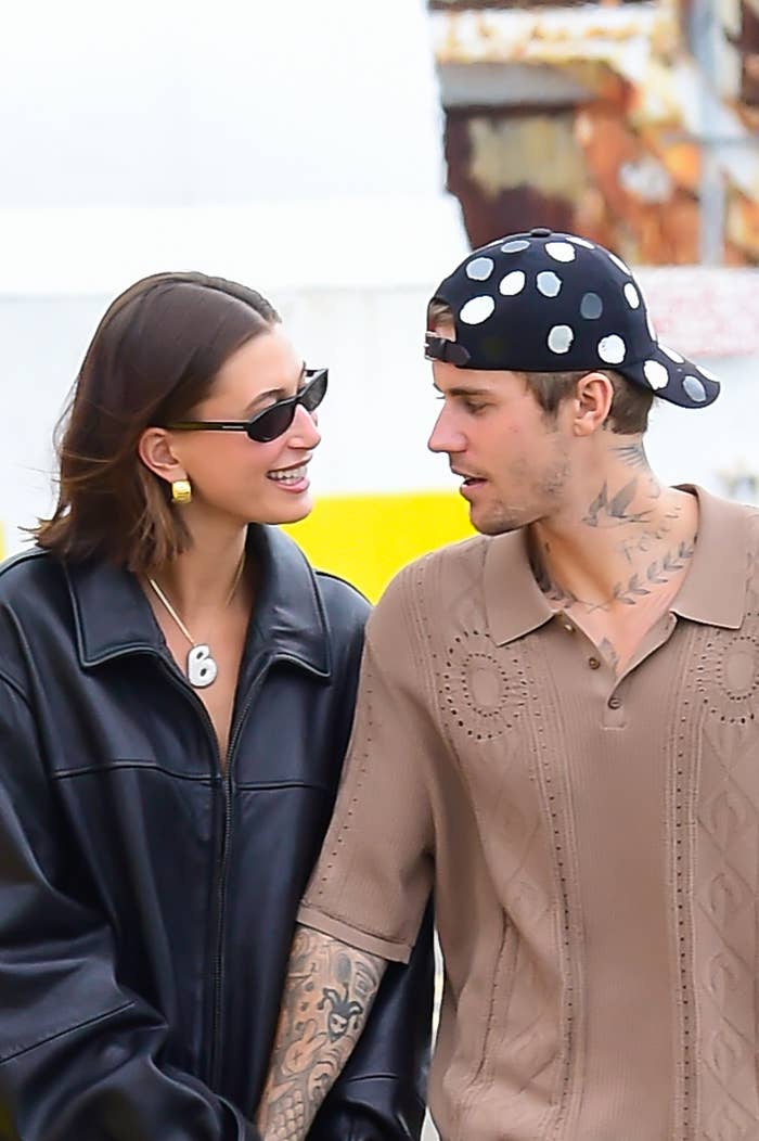 Hailey Bieber smiling at Justin Bieber while walking with him