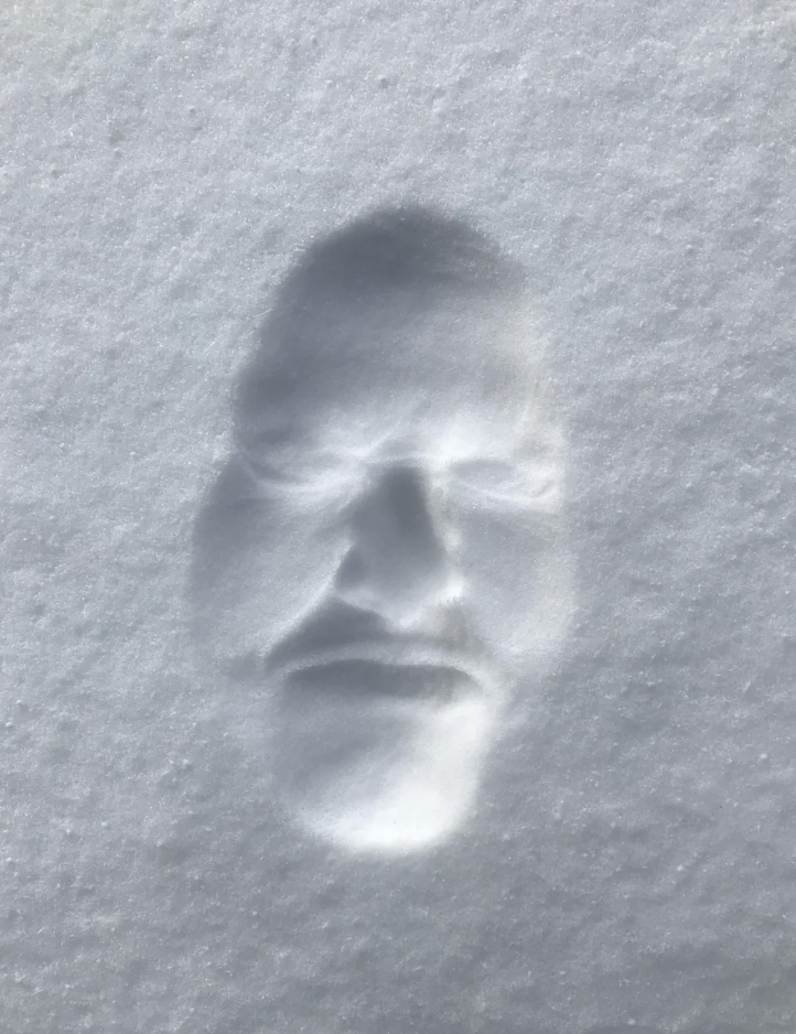 A look   content   successful  snow, showing closed eyes, nose, and rima  intelligibly  molded