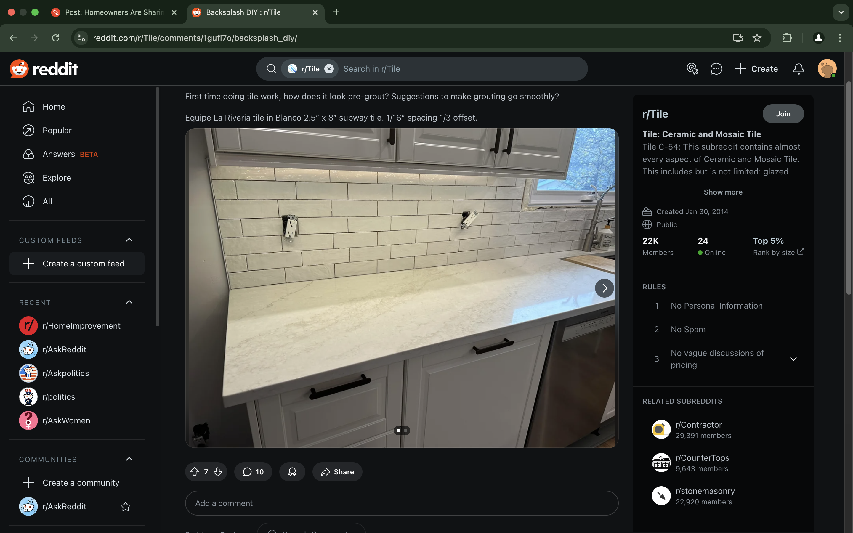 Kitchen countertop with white subway tile backsplash and under-cabinet lighting. Electrical outlets visible on the backsplash
