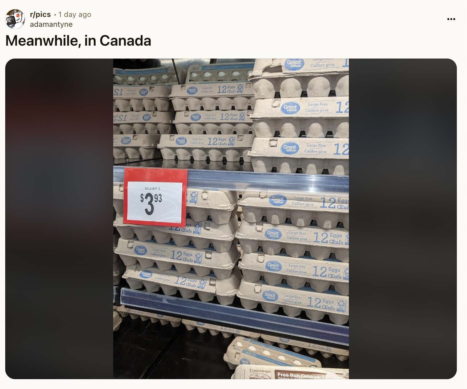 Egg cartons stacked in a store display with a sign showing the price as $3.93