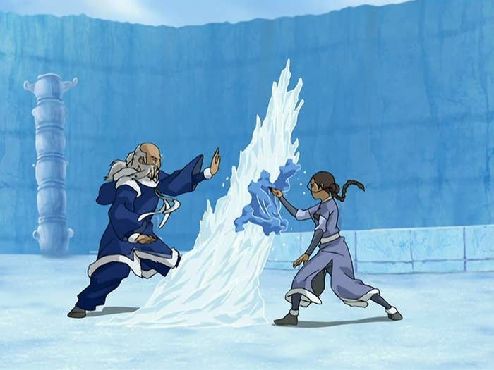Two characters practicing waterbending in an icy arena, with one creating a wave and the other responding. Scene from an animated series