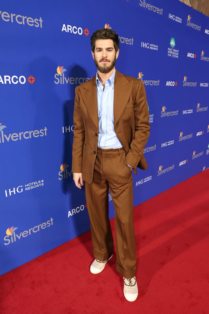 Andrew on red carpet in a suit