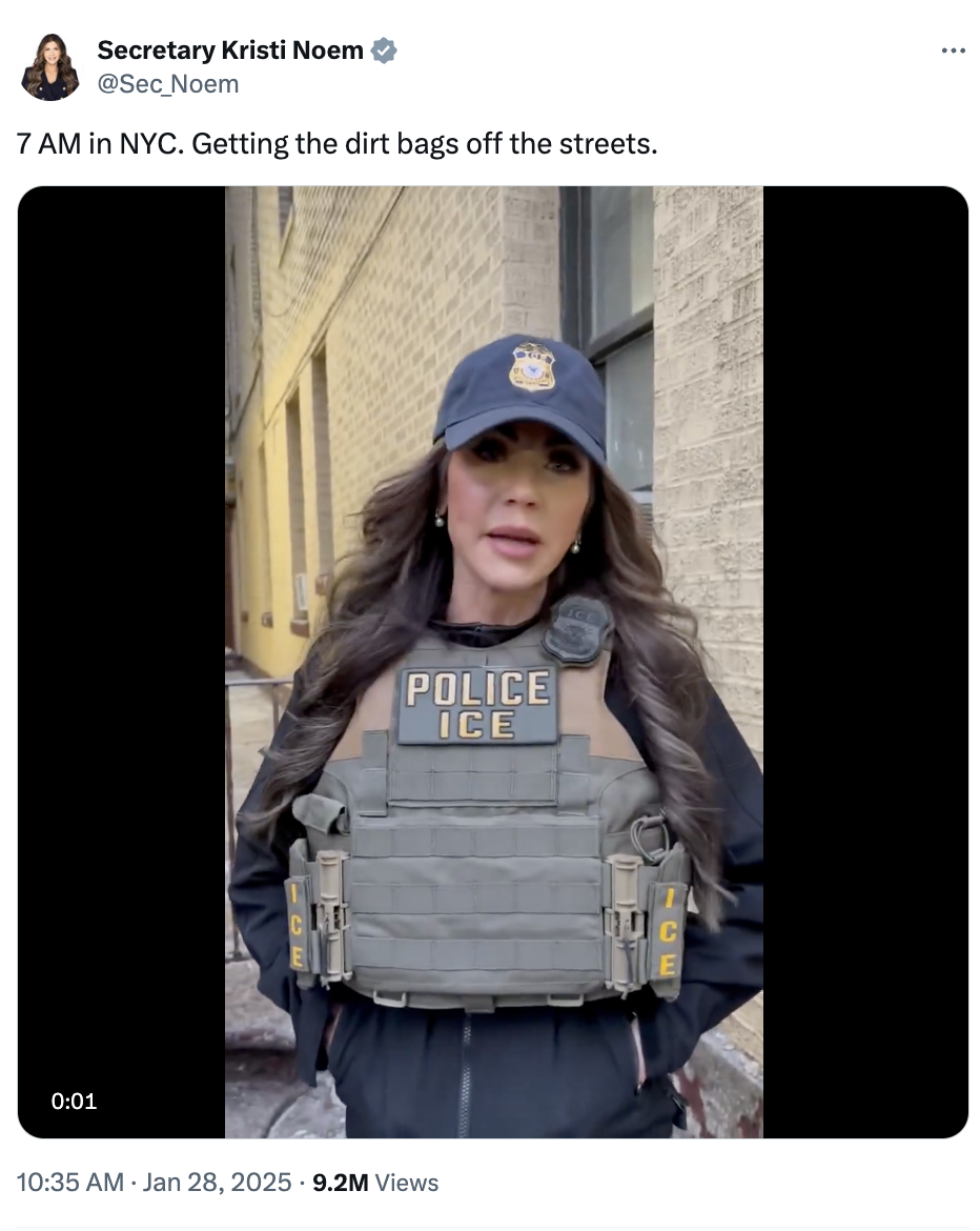 A person in tactical gear and a cap stands in a city alley. The gear reads "POLICE ICE". Text mentions cleaning streets at 7 AM in NYC