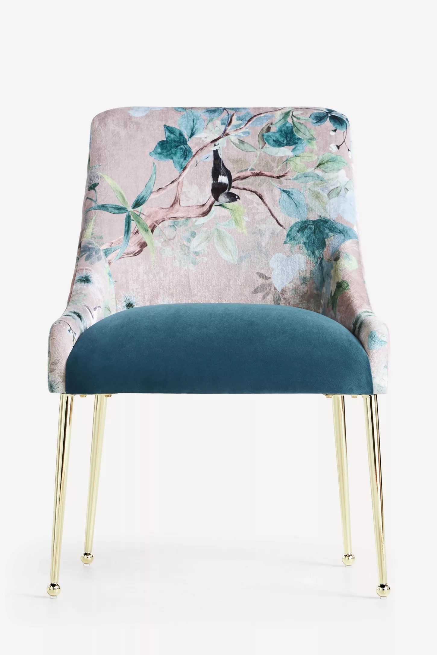 Elegant chair with a floral upholstered backrest and velvet seat. Features slim, metallic legs. Ideal for stylish home decor