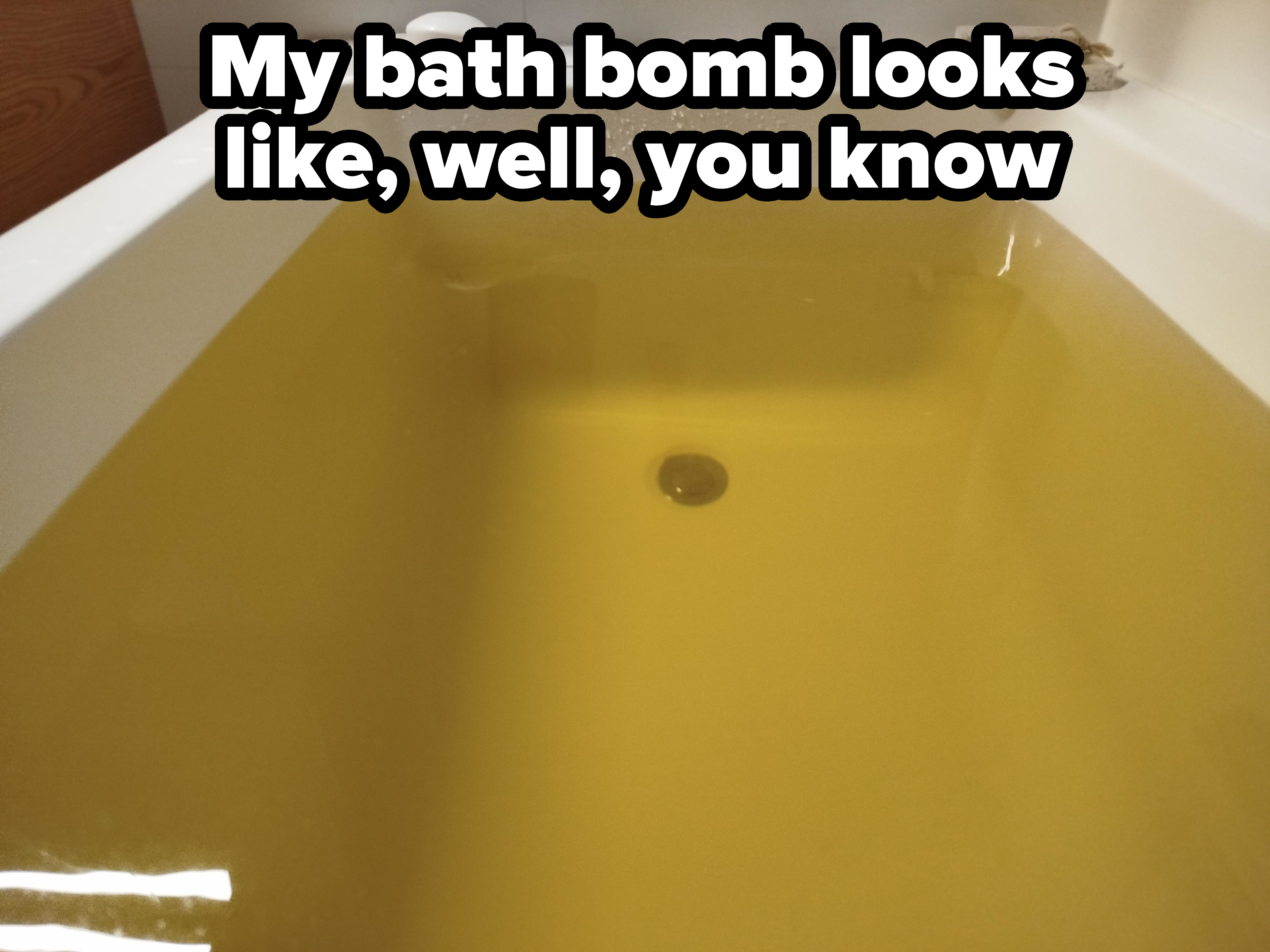 Bathtub filled with yellow water