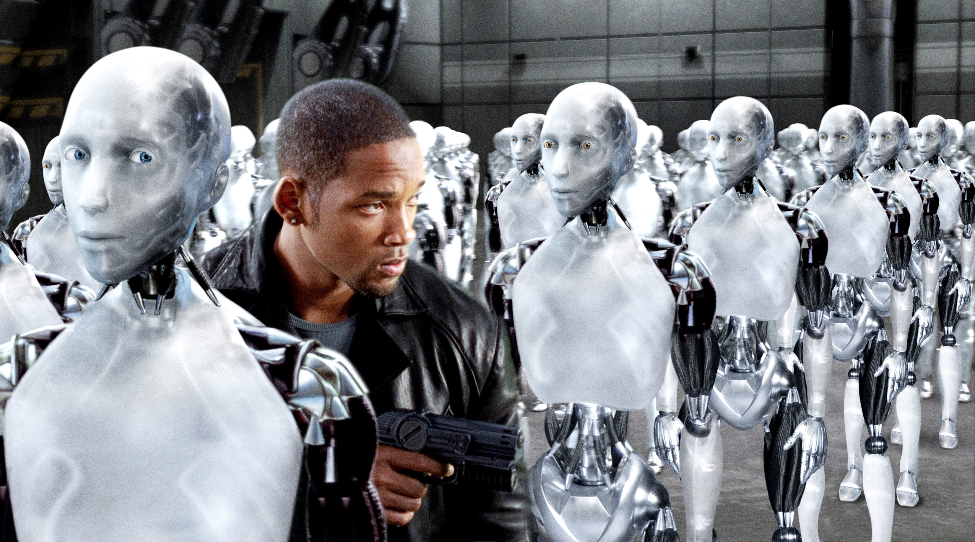A man holding a gun is surrounded by futuristic humanoid robots in a high-tech setting
