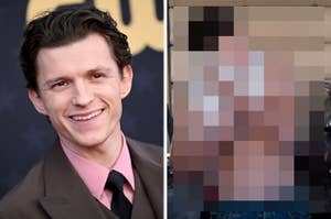 Smiling male celebrity wearing a pink shirt and suit jacket at an event, standing on a carpet