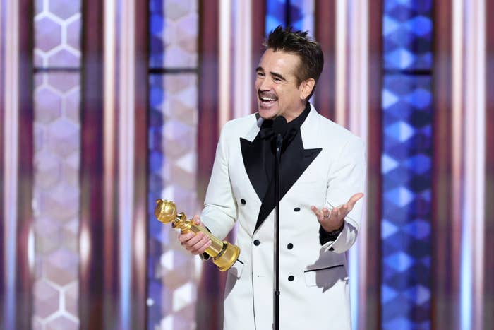 Colin Farrell in a double-breasted suit as he accepts his Golden Globe