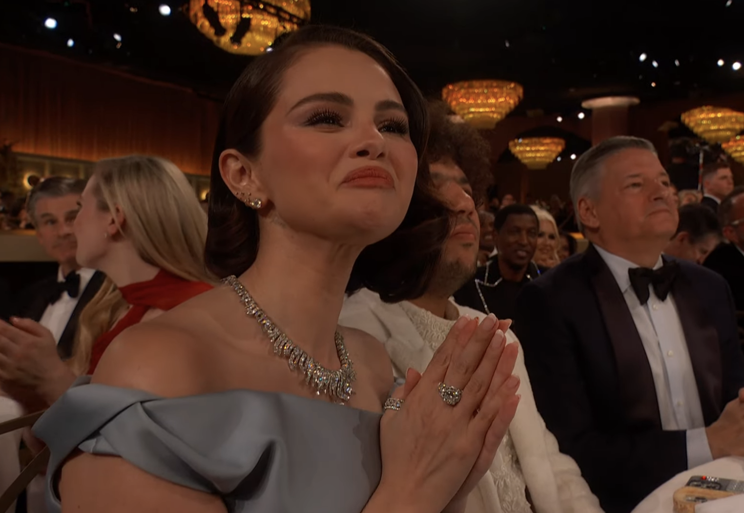 Selena Gomez looks emotional while clapping at the Golden Globes