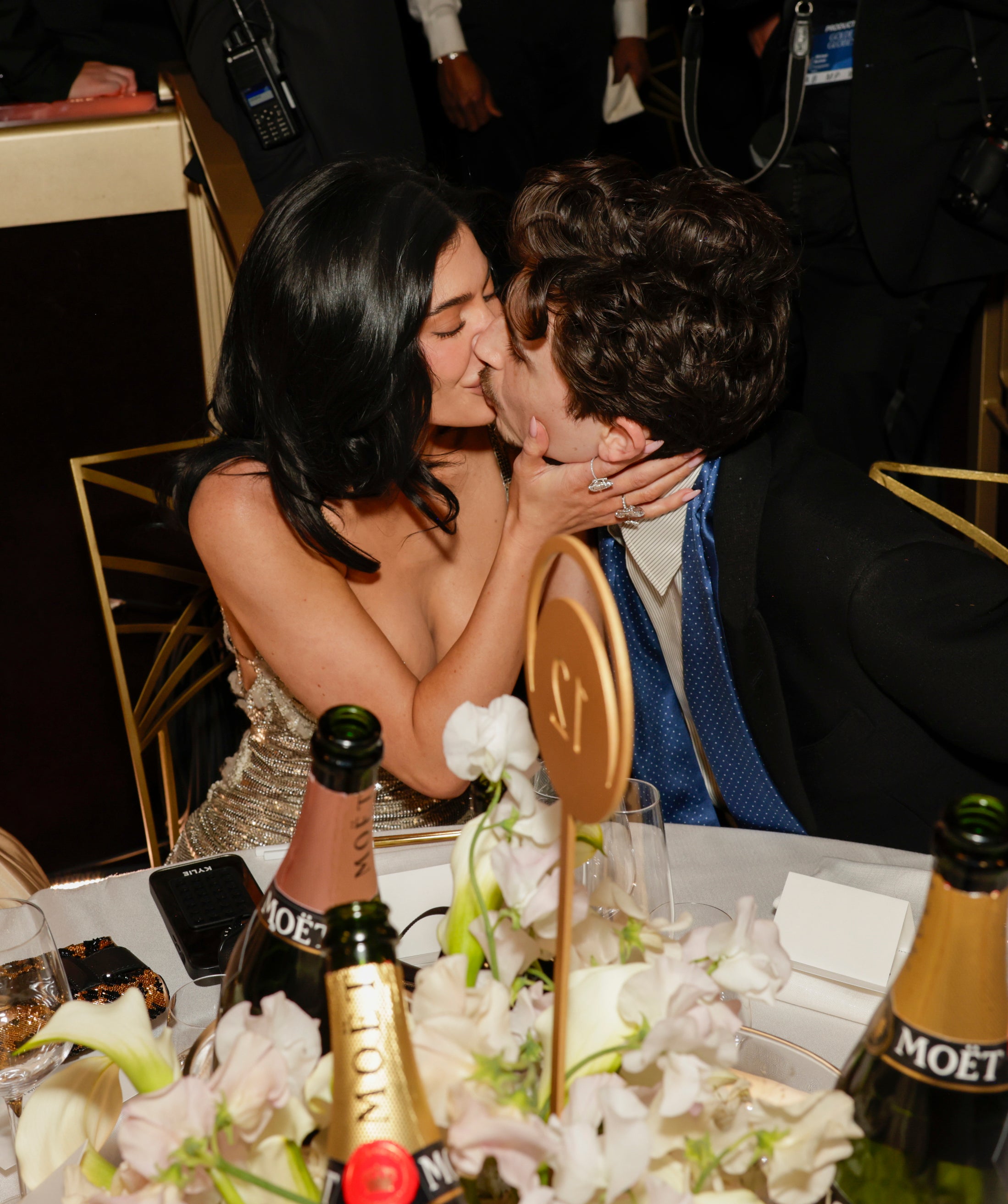 Kylie Jenner and Timothée Chalamet kissing while seated inside at the Golden Globes