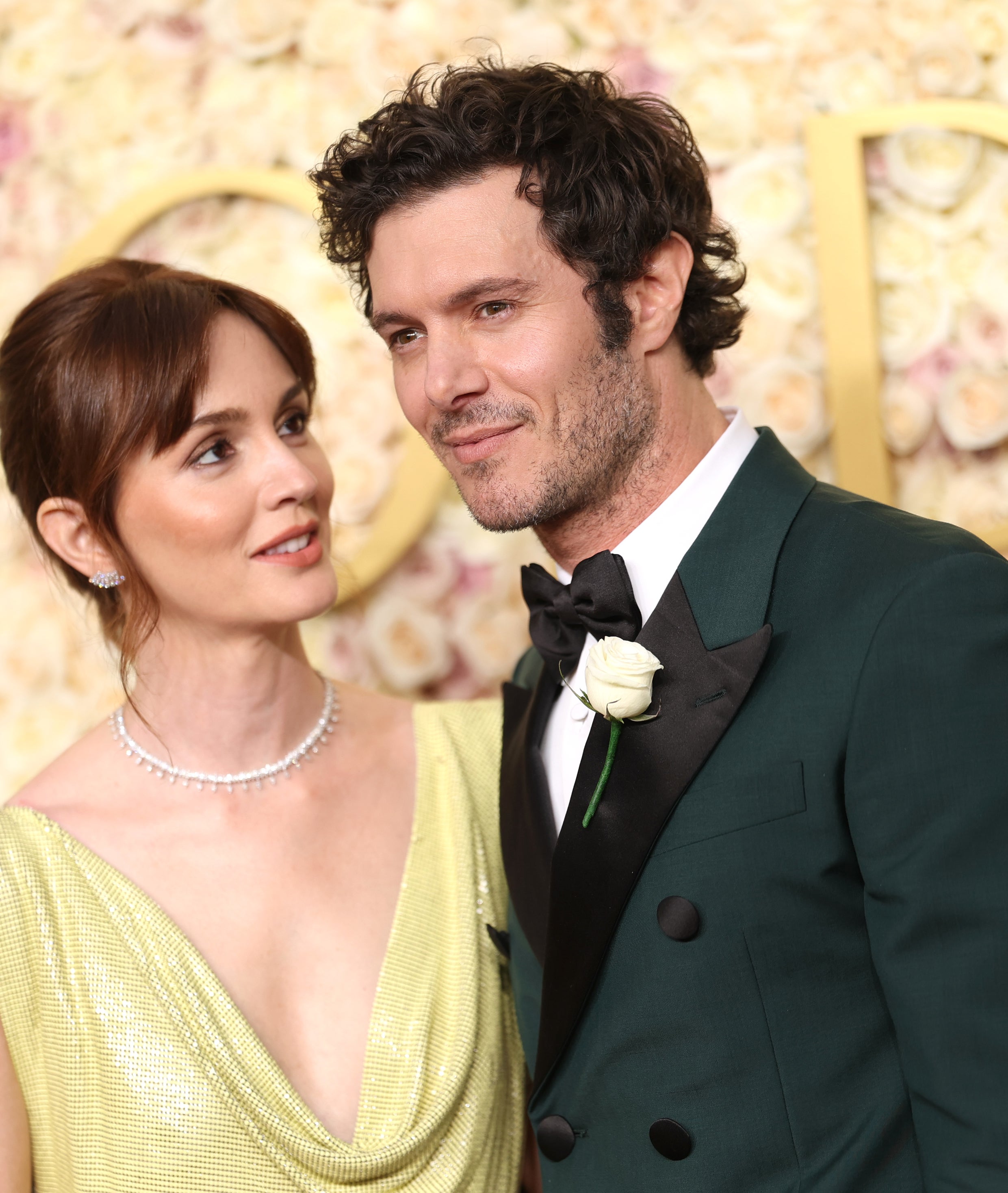 Leighton Meester and Adam Brody posing at the Golden Globes