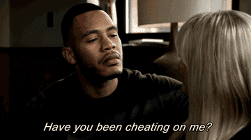 A man with a serious expression asks a woman, &quot;Have you been cheating on me?&quot;