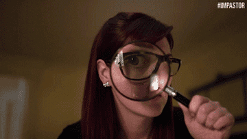 Person with glasses looking through a magnifying glass, playfully enlarging one eye. Hashtag &quot;Impostor&quot; in the corner