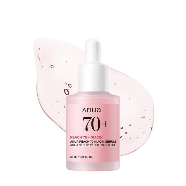Anua Peach 70+ Niacin Serum bottle with a liquid drop behind it, featuring skincare product details