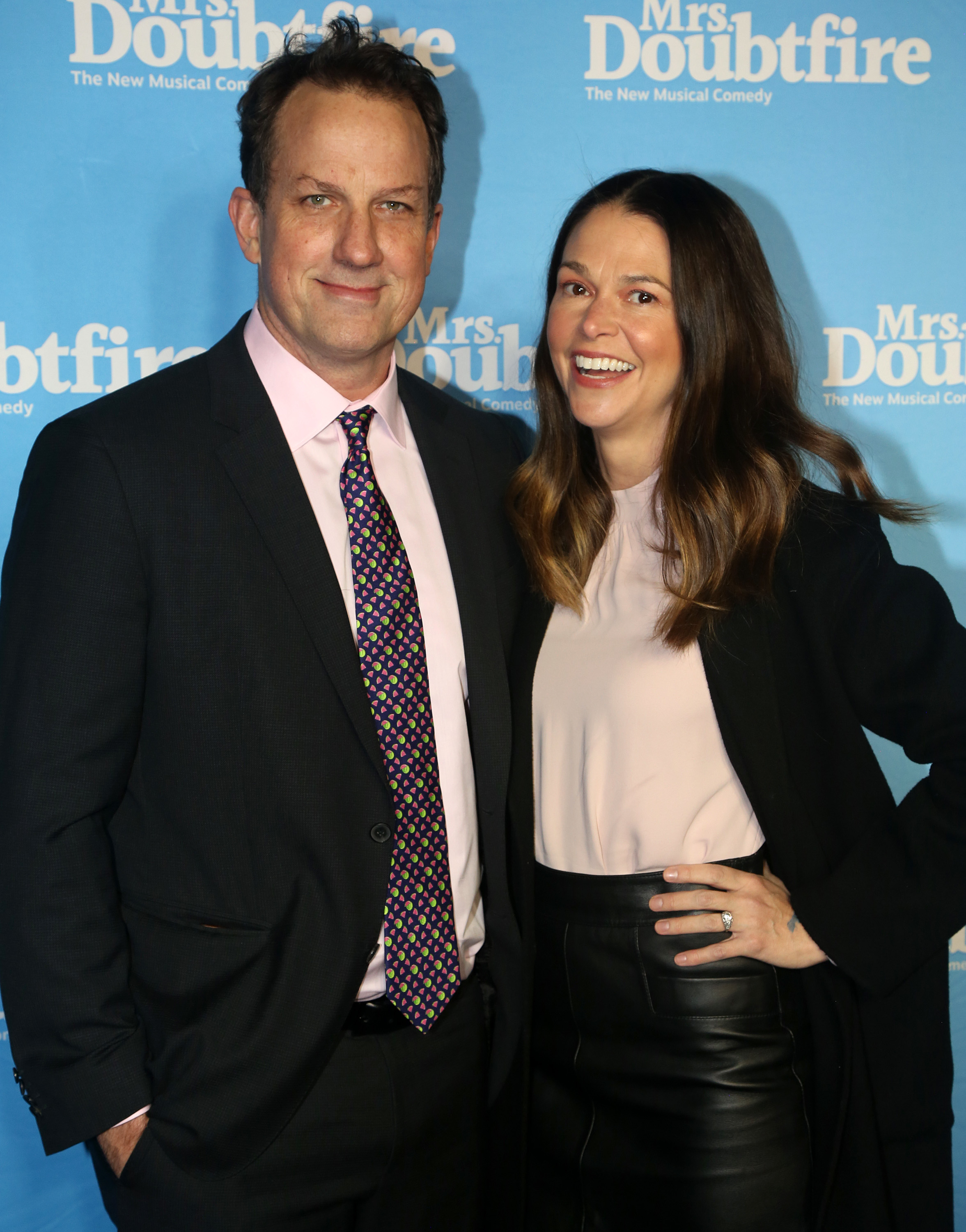 Ted Griffin and Sutton Foster smiling at an event