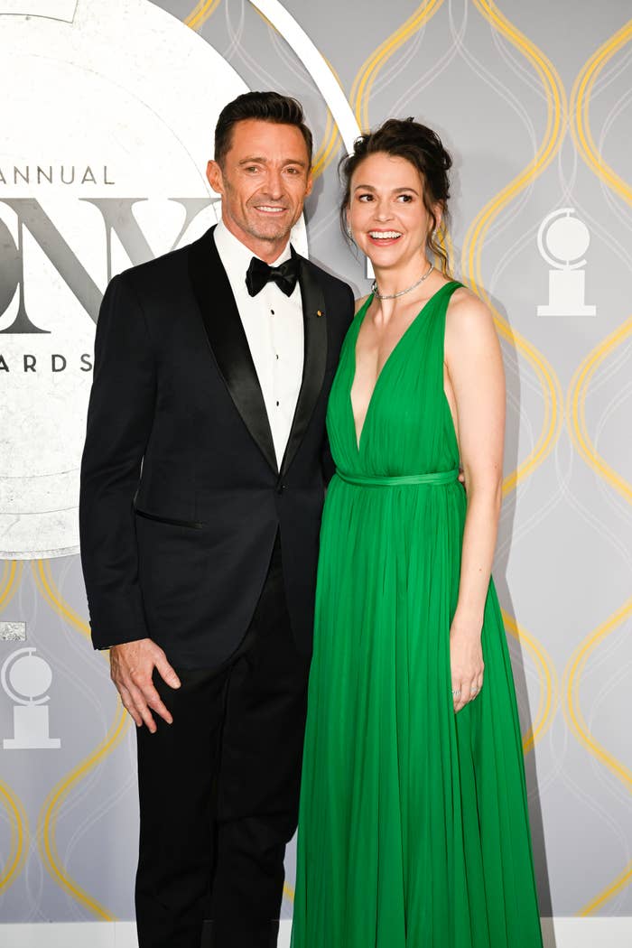 Hugh Jackman and Sutton Foster pose at an event