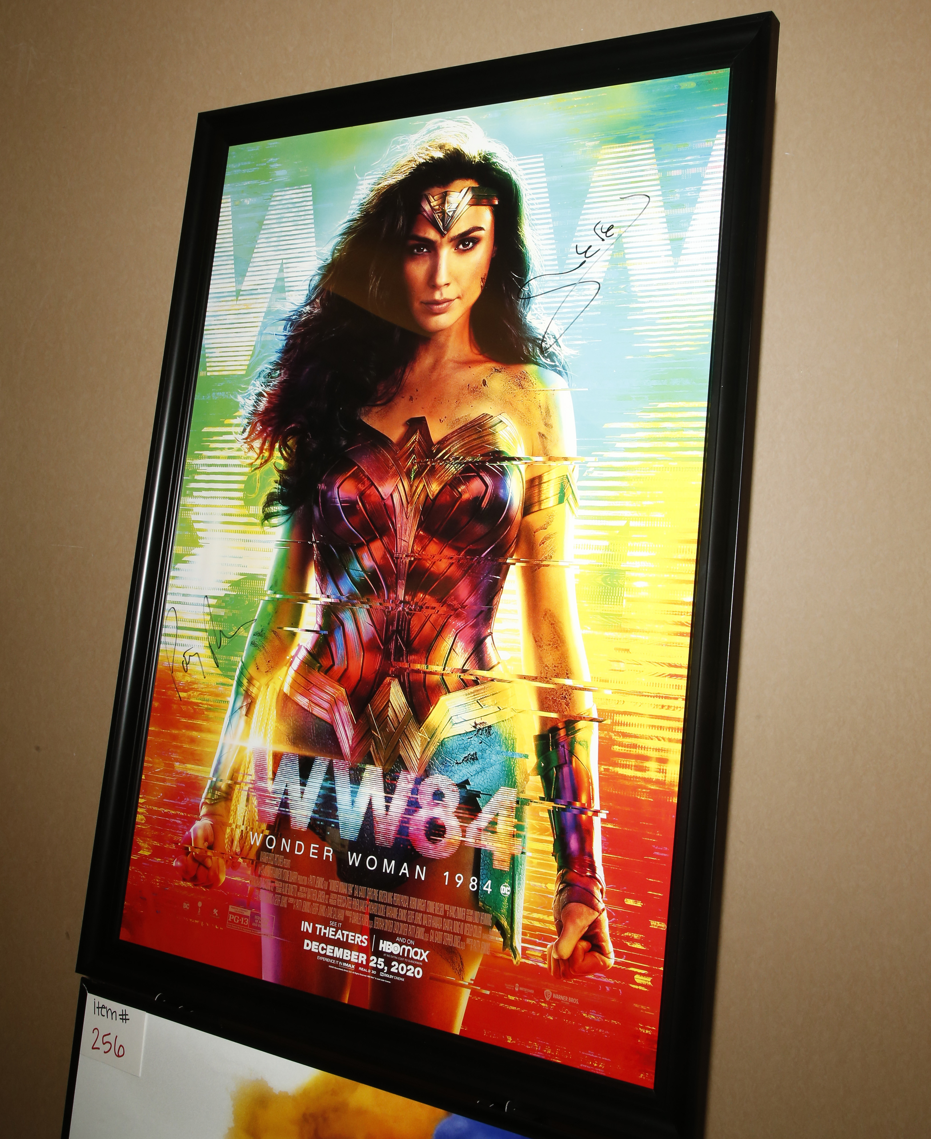 Framed &quot;Wonder Woman 1984&quot; movie poster featuring superhero in dynamic pose with bold costume detail