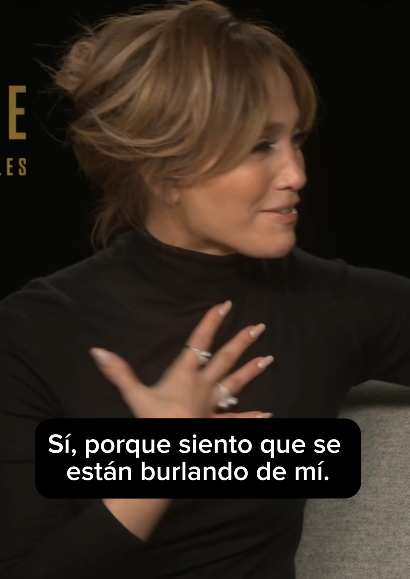 J.Lo in a black turtleneck speaks in an interview; caption reads, &quot;Sí, porque siento que se están burlando de mí.&quot;