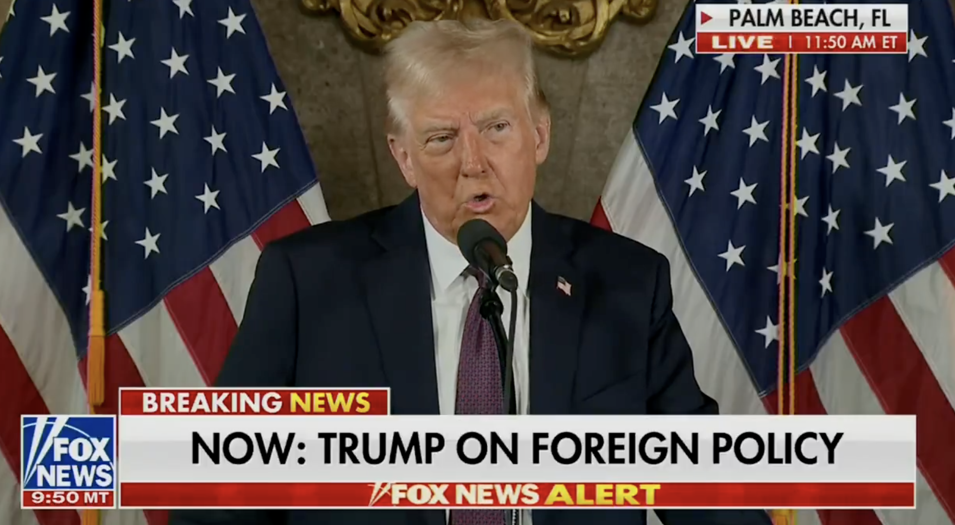 A person speaks at a podium with U.S. flags behind. Fox News caption reads: &quot;NOW: TRUMP ON FOREIGN POLICY&quot; with a Palm Beach, FL location tag