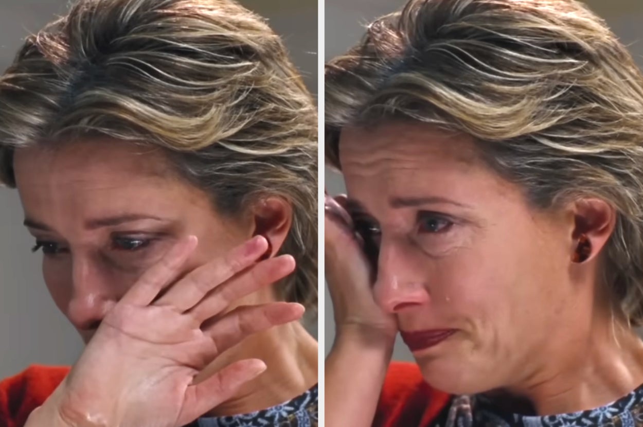 Person wiping tears, appearing emotional