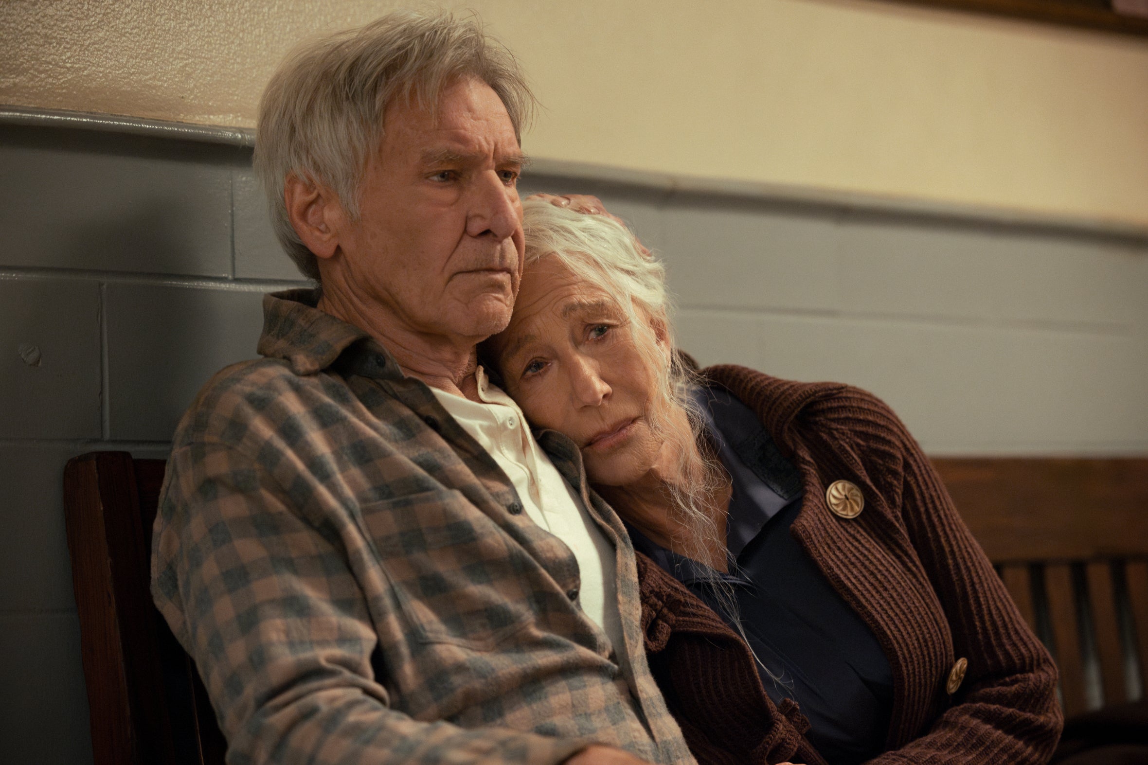 Harrison Ford holding Helen Mirren, who looks sad, in a scene from "1923"