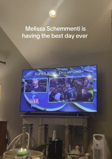 TV displays "Super Bowl Champions" with celebratory scenes; text reads "Melissa Schementi is having the best day ever."