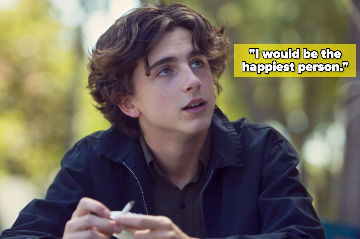 Person with wavy hair in casual jacket looking upwards, with text bubble: "I would be the happiest person."