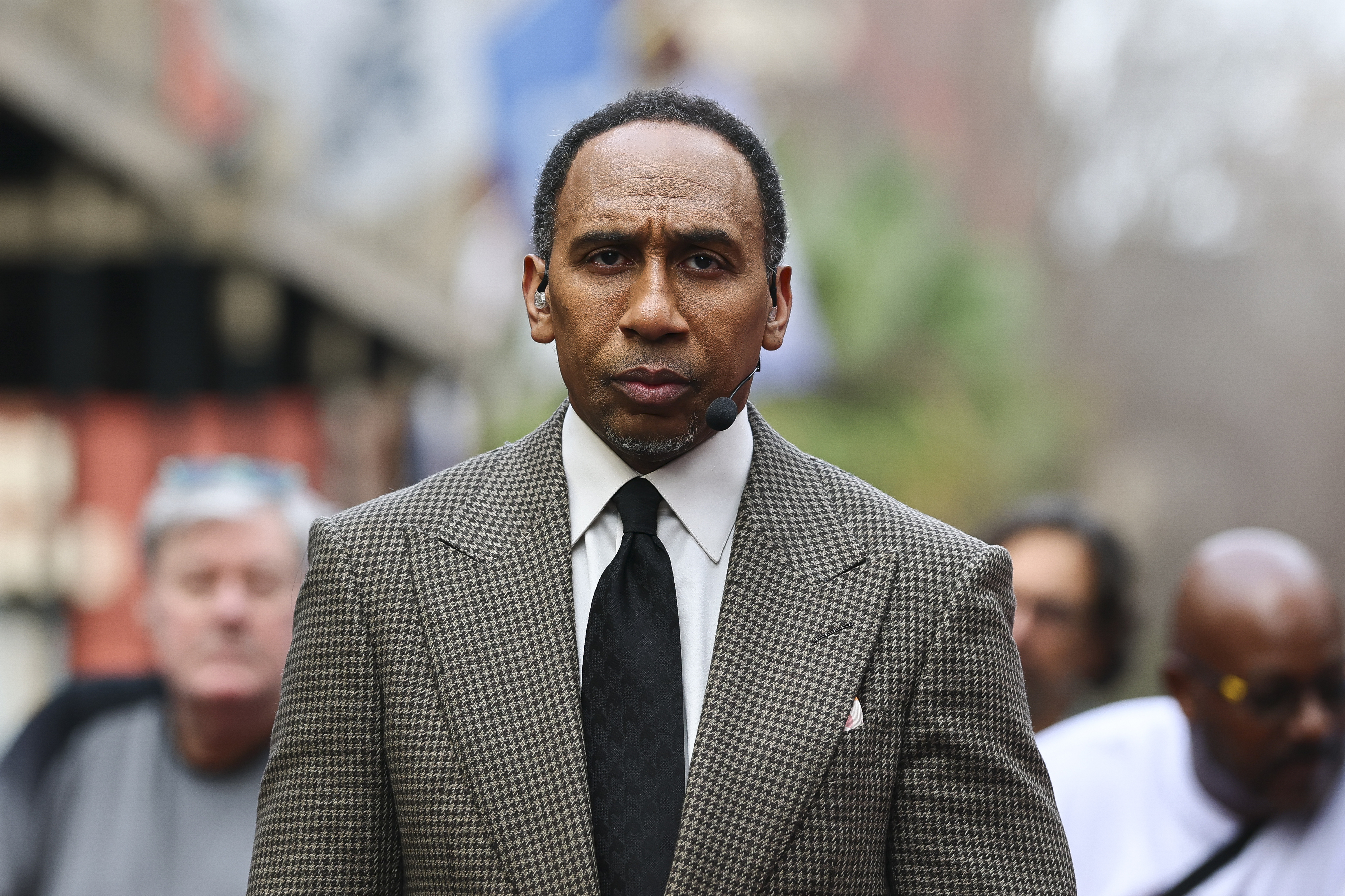 Close-up of Stephen A. Smith standing outdoors