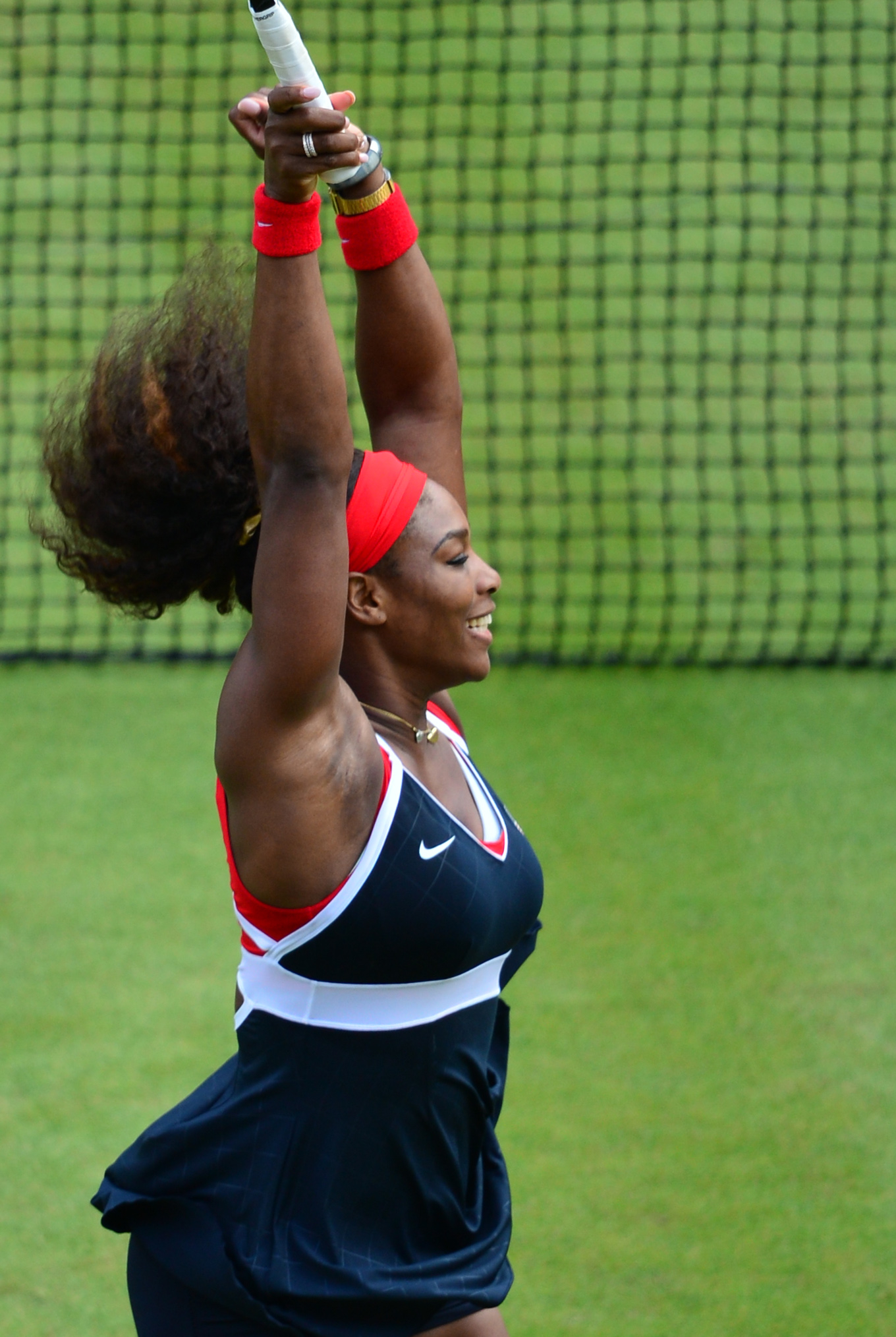 Serena Williams celebrates on grass court