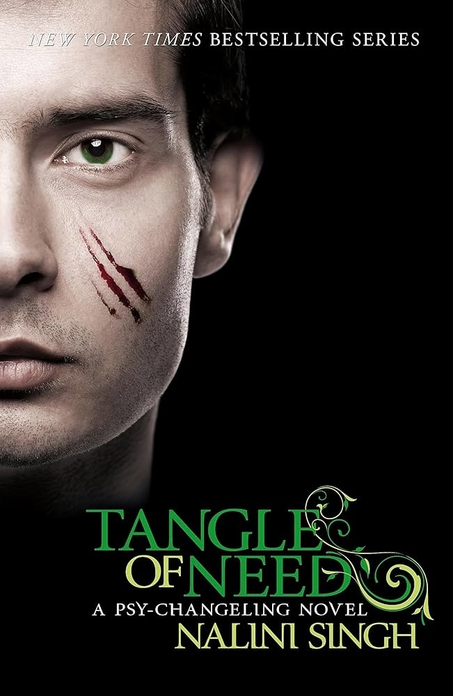 Book cover for &quot;Tangle of Need&quot; by Nalini Singh; features a close-up of a person&#x27;s face with claw marks and green text below
