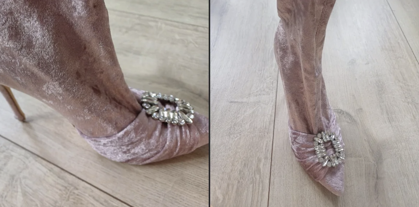 Close-up of pink velvet high-heeled boots with rhinestone embellishments on the toes, showcased on a wooden floor