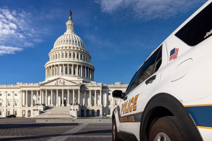 U.S. Capitol building with a Capitol Police vehicle in the foreground, showing presence and security