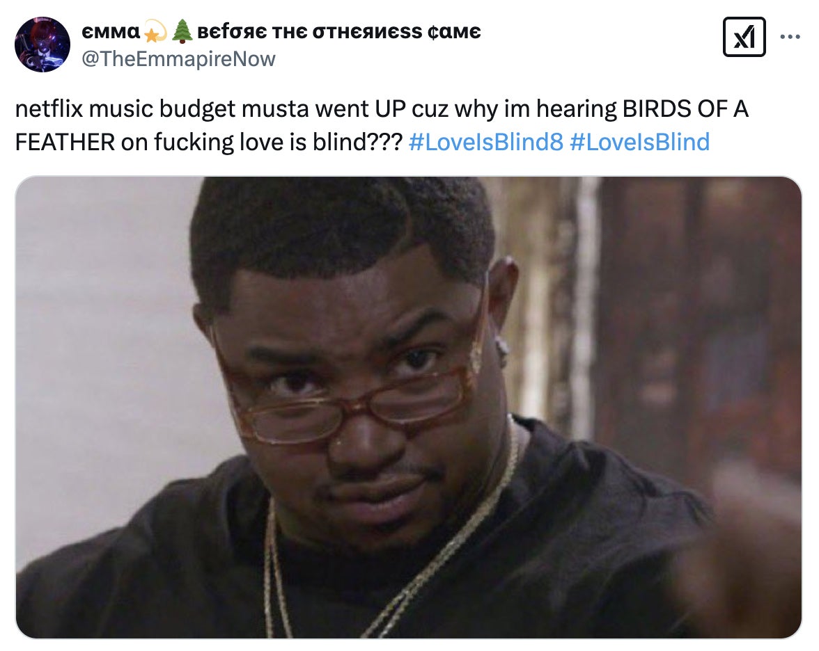 A person with a surprised expression and glasses raised sits indoors. A tweet above jokes about Netflix music budget and references "Love Is Blind."