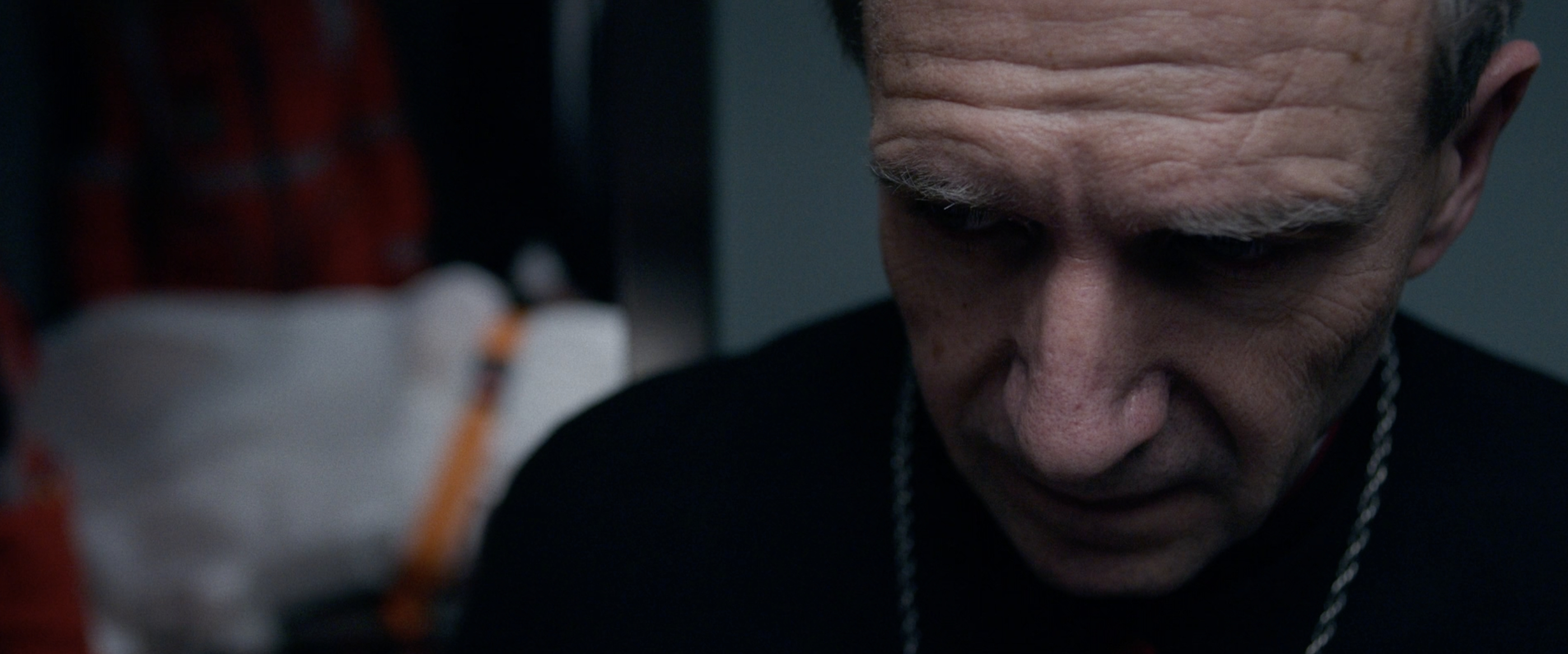 Close-up of Ralph Fiennes as a cardinal in "Conclave"