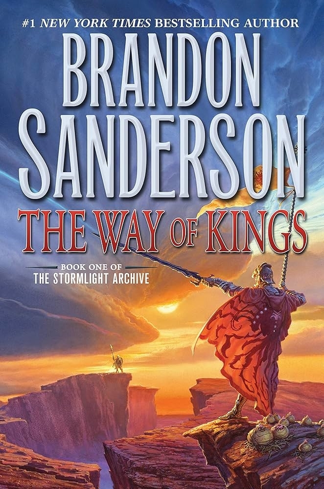 Cover of &quot;The Way of Kings&quot; by Brandon Sanderson, features a figure in armor with a cape, holding a spear on a rocky landscape. Book one of The Stormlight Archive
