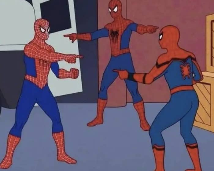 Three animated Spider-Man characters stand in a room, each pointing at the other in confusion, creating a humorous standoff