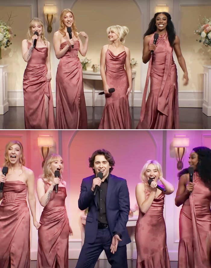 Four performers in matching elegant dresses sing on stage, joined by a person in a dark suit