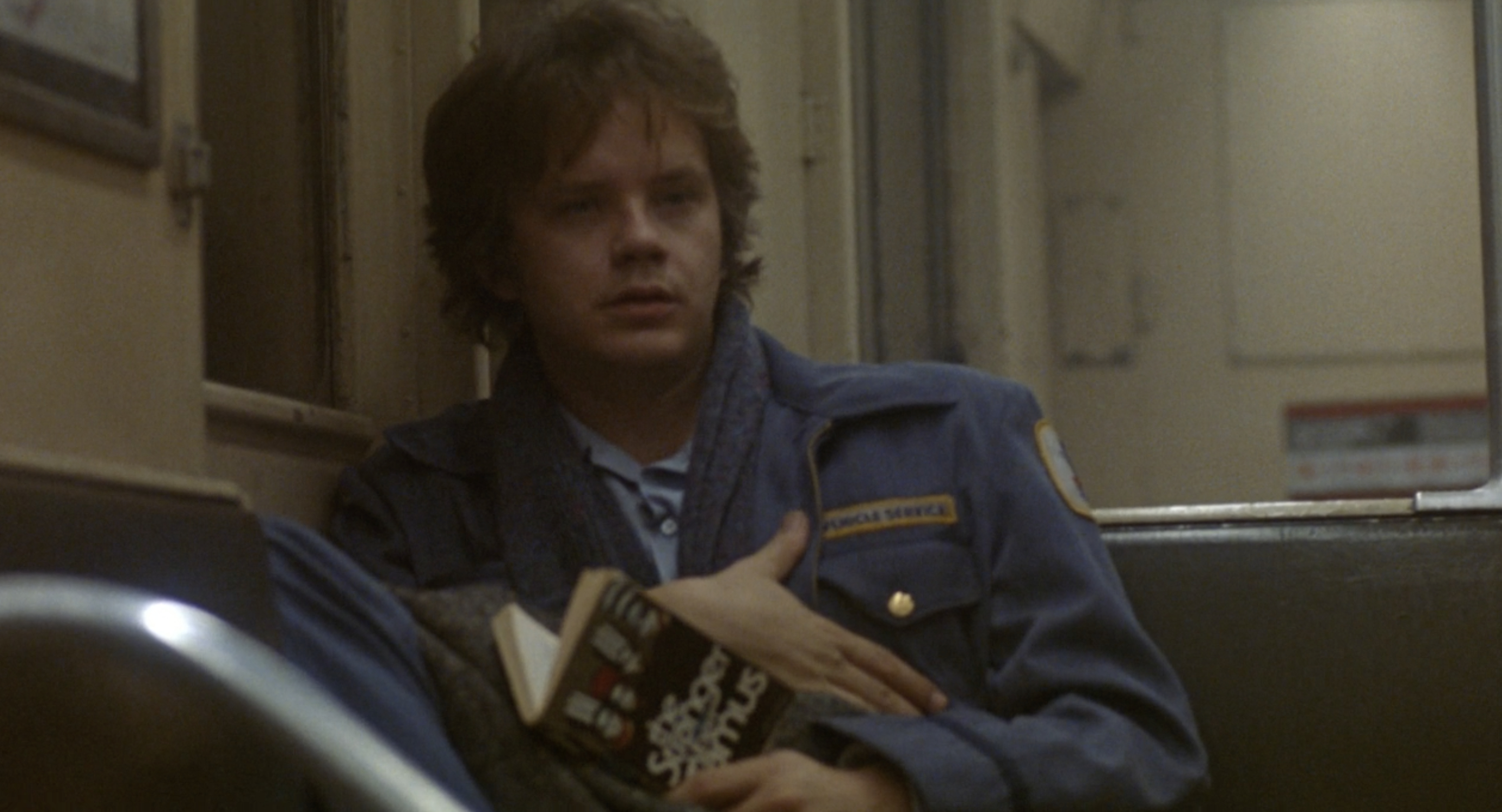 Tim Robbins sits on a subway and stares into space in a scene from &quot;Jacob's Ladder&quot;