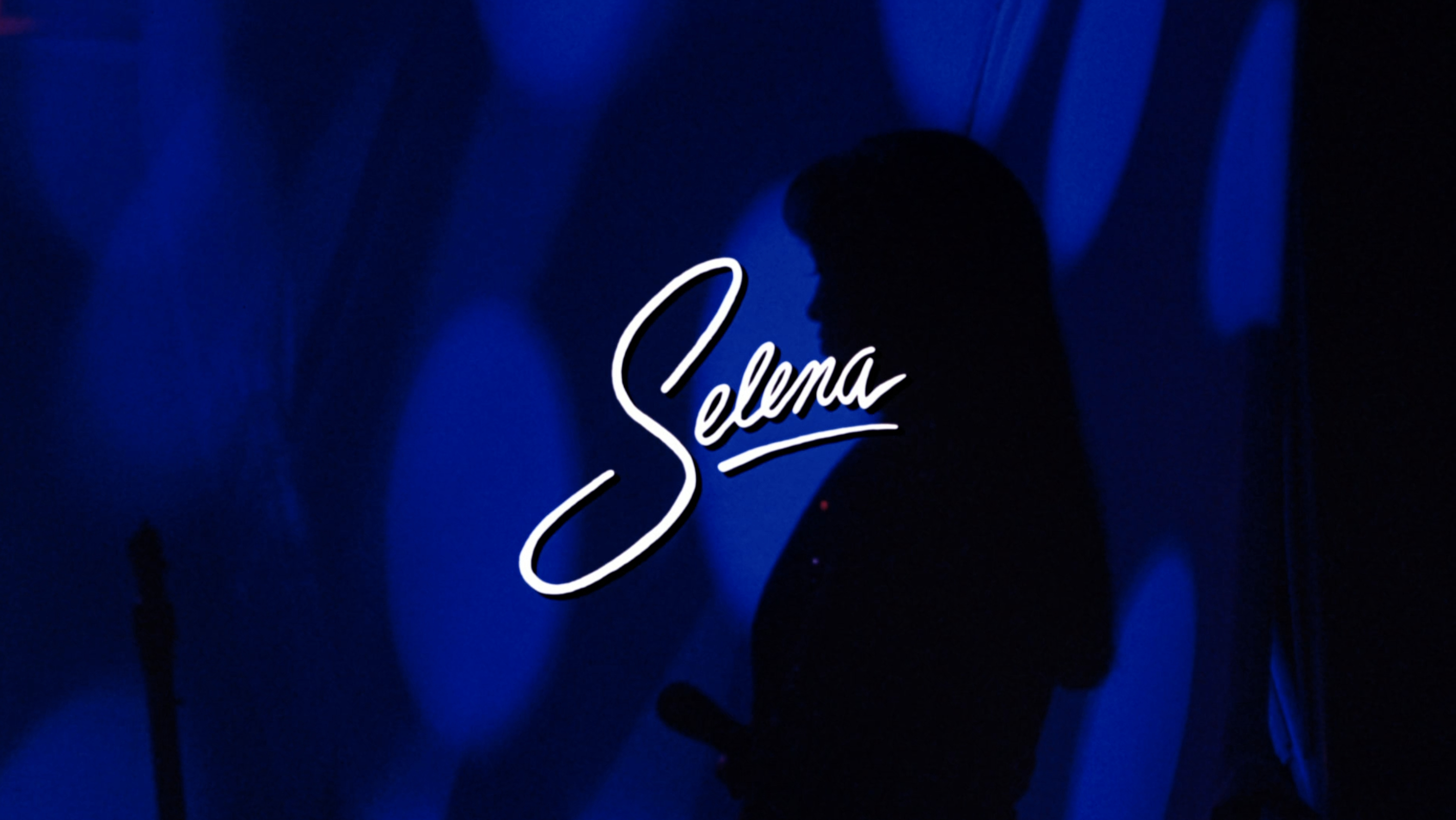 Title card for the film &quot;Selena&quot; with a silhouette of Jennifer Lopez holding a microphone