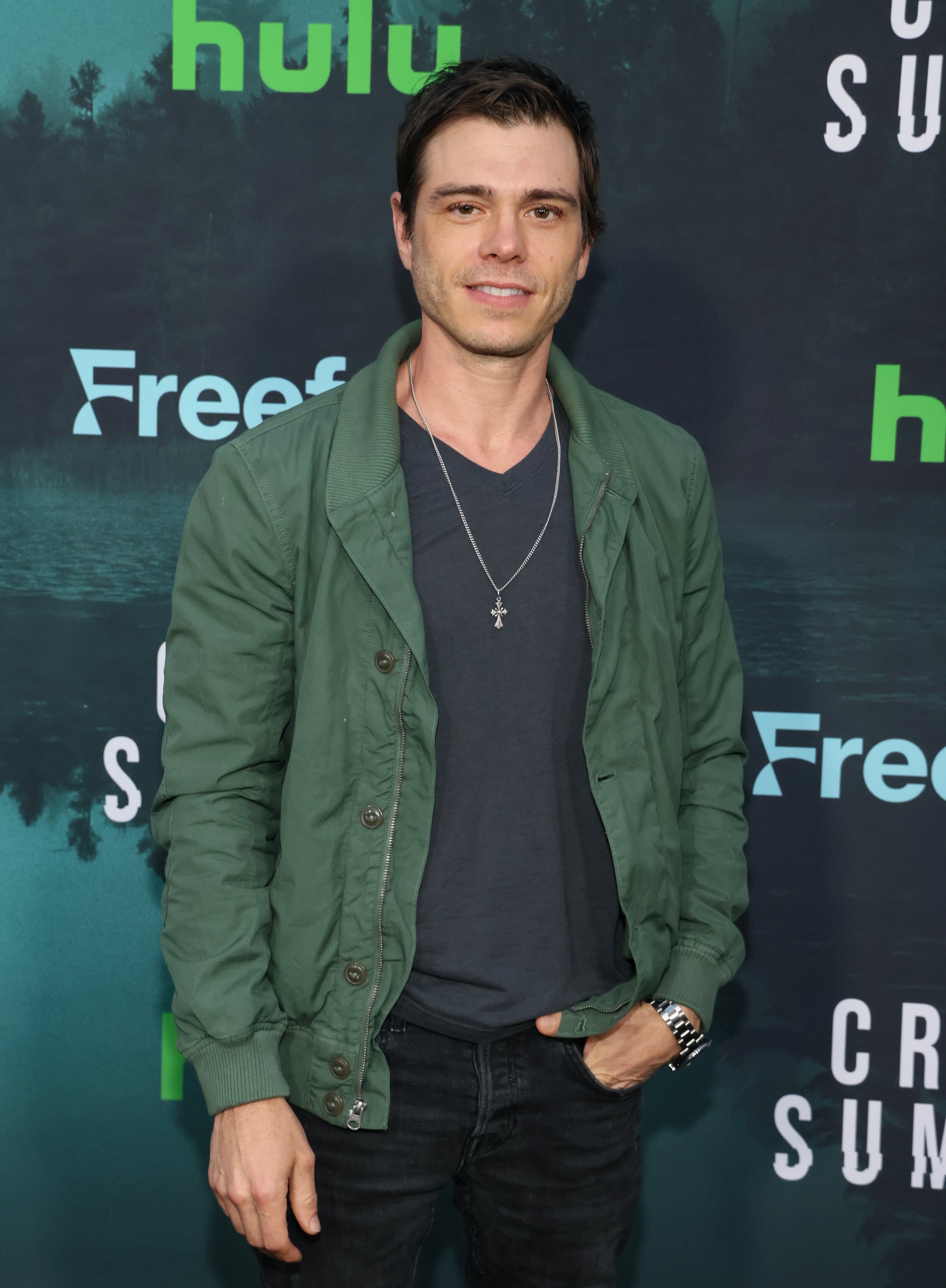 Matthew Lawrence in a casual jacket and t-shirt at a Hulu event backdrop