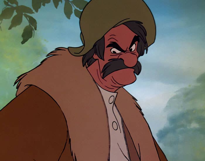 Animated quality with a bushy mustache, wearing a fur-lined overgarment and cap, appears serious, acceptable successful a earthy backdrop