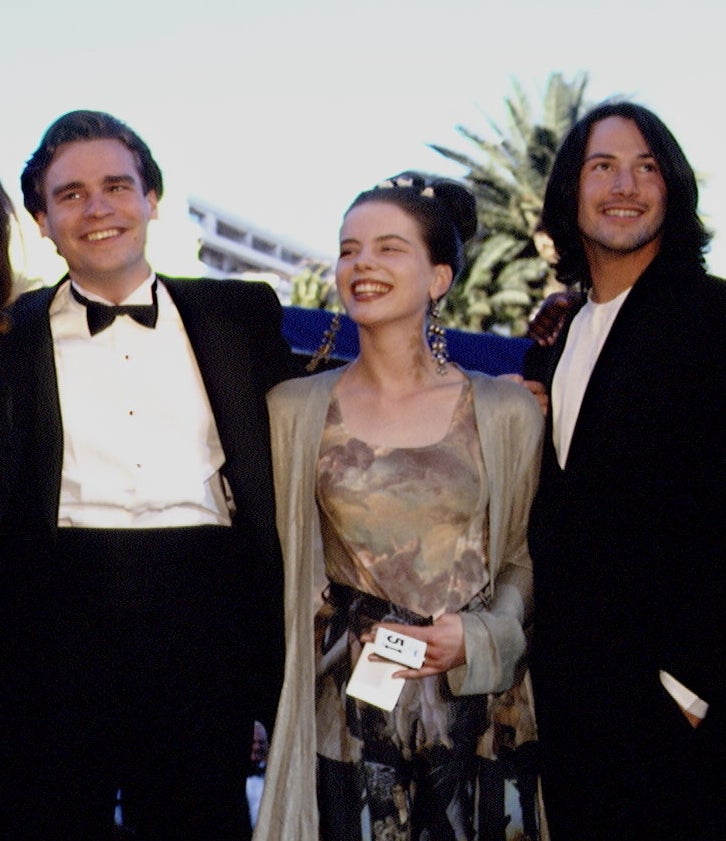 Robert Sean Leonard and Keanu in tuxes on either side of Kate in a pattered dress with cardigan