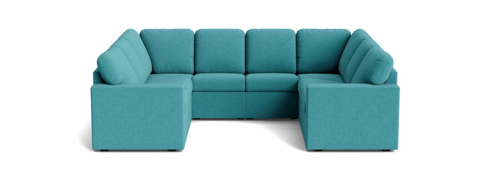 A modern, modular sectional sofa with straight lines and plush cushions, ideal for contemporary living spaces