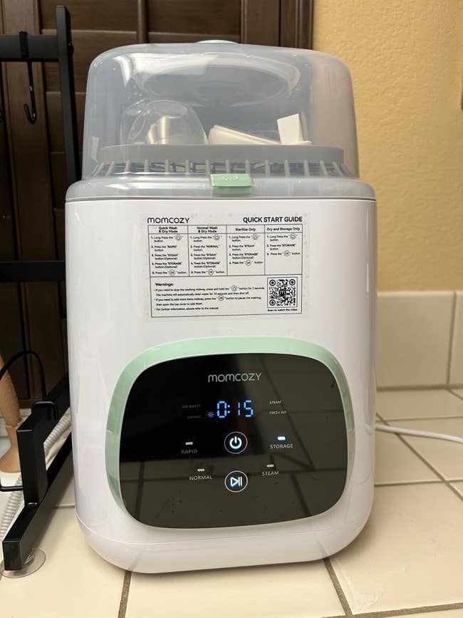 Baby vessel sterilizer connected a room antagonistic with power panel. Quick commencement usher disposable connected top, including a QR codification for much information