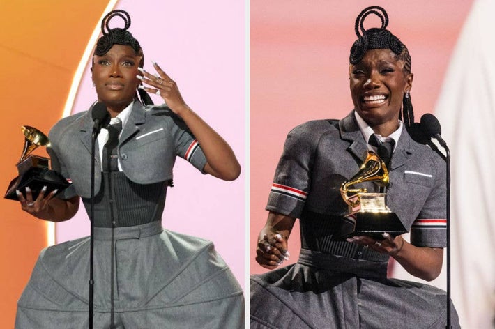 Person in a structured gray outfit holds a Grammy award while speaking on stage at an event