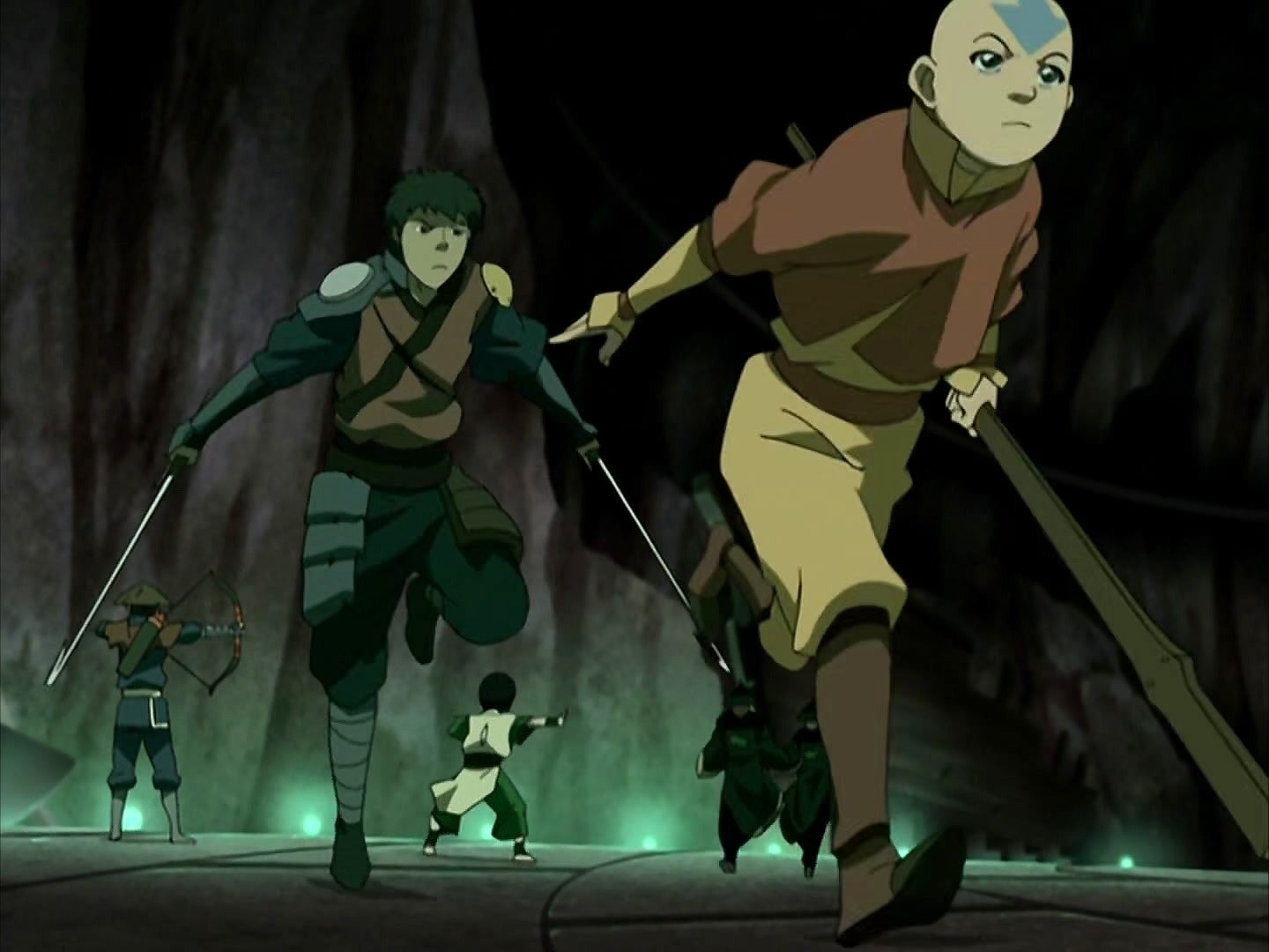  The Last Airbender" in action poses inside a cave, featuring Aang at the front holding a staff